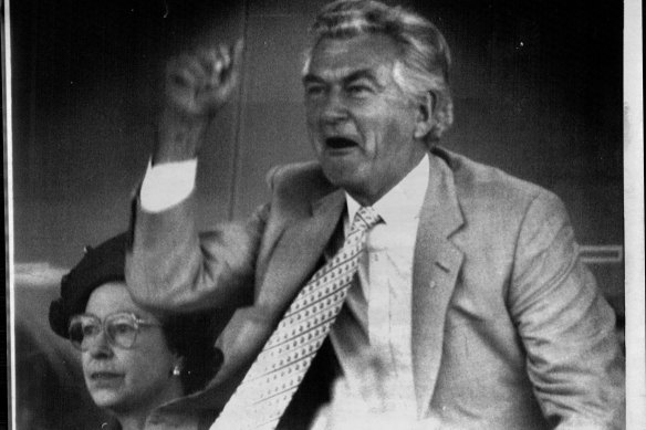 We are amused: Bob Hawke cheers Beau Zam home in the Queen Elizabeth Stakes as the Queen sits impassively. 