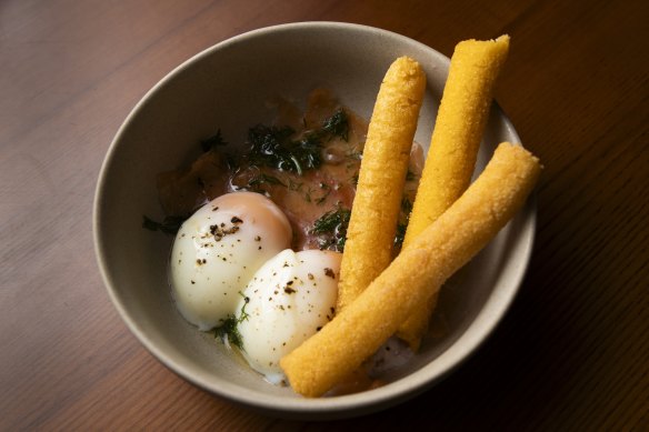Soft-boiled eggs with polenta soldiers and smoked salmon.