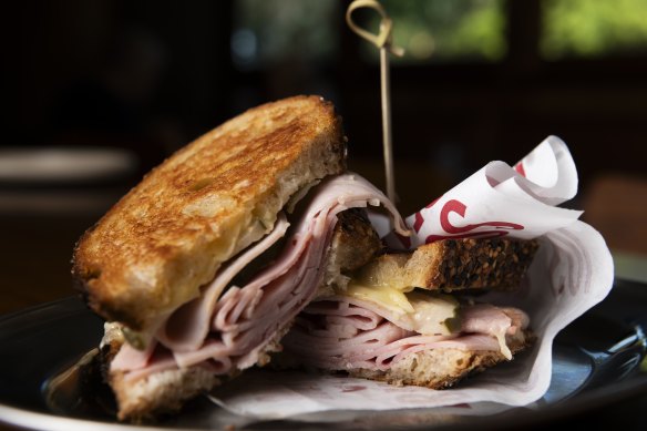 Toasted ham, cheese and pickle sandwich.