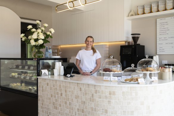Laura Capewell behind the counter of her Caringbah bakery-cafe Baked Collective.