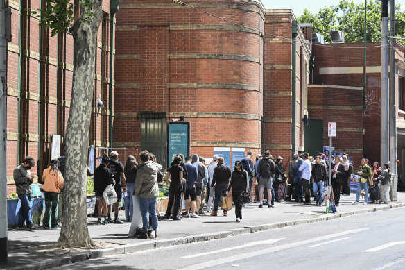 A long queue for voting at Drill Hall in the City of Melbourne on Friday afternoon.
