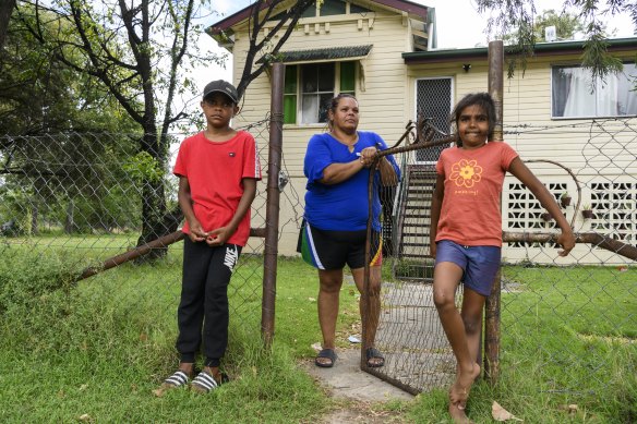 Melanie McGrady with her daughter Taqueesha Williams and nephew Zachary McIntosh outside their Boggabilla home. 