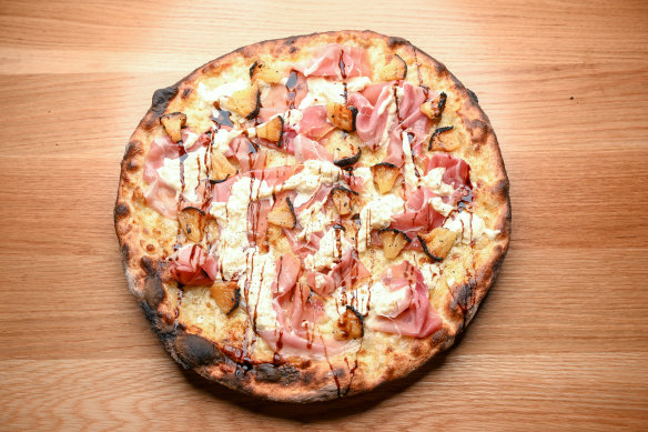 Smoky pineapple pizza with prosciutto and stracciatella cheese.