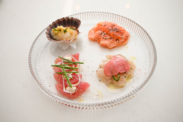 A tasting plate of raw tuna, salmon, kingfish and scallop.