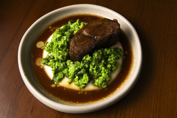 Lamb braised in coffee with turnip and peas.