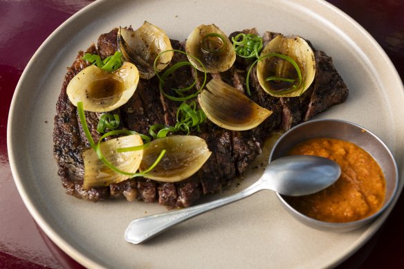 The beef chop with recado negro, roasted onion and salsa picante.
