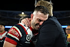 James Tedesco is consoled by Trent Robinson.