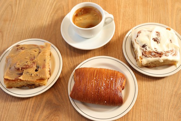 Coffee and baked goods at Hector’s Bakery, including the cinnamon bun with “Cinnabon vibes”(right).
