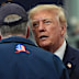 President Donald Trump talks with Sen. Dan Sullivan at a campaign event earlier this month.