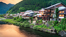 Gujo Hachiman, Japan hot springs town at dusk over the Yoshida River.