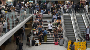 Travellers face delays at the Gare de Montparnasse station in Paris.