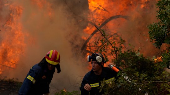 Firefighters battle blazes in Greece during heatwaves exacerbated by extreme heat.