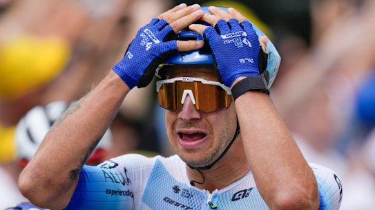 tage winner Netherlands’ Dylan Groenewegen celebrates as he crosses the finish line of the third stage of the Tour de France cycling race over 182 kilometers (113 miles) with start in Vejle and finish in Sonderborg, Denmark, Sunday, July 3, 2022. (AP Photo/Daniel Cole)