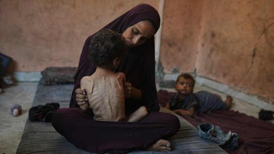 Naima Abu Ful and her two-year-old Yazan in the Shati refugee camp in Gaza City.