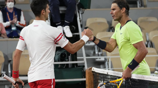 Novak Djokovic and Rafael Nadal shake hands after their semi-final at Roland-Garros last year.