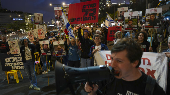 Protesters demand the release of hostages held in the Gaza Strip, in Tel Aviv, Israel, on Tuesday.