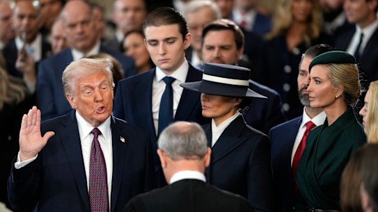 Donald Trump is sworn in as the 47th president of the United States by Chief Justice John Roberts as Melania Trump holds the Bible during the 60th Presidential Inauguration in the Rotunda of the U.S. Capitol in Washington, Monday, Jan. 20, 2025. (AP Photo/Julia Demaree Nikhinson, Pool)
