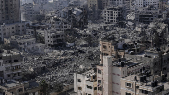 Destruction from Israeli aerial bombardment is seen in Gaza City on October 11.