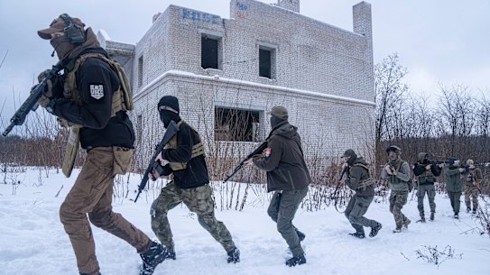 Members of a Ukrainian far-right group train in Kharkiv, Ukraine, on Saturday, January 29, as the Ukraine tourism board urges people to visit the “sleepless” border city at the centre of the crisis.