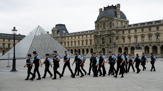 Security patrol in front of the Louvre Museum in Paris.