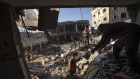 Palestinians search for bodies and survivors in the rubble of a residential building destroyed in an Israeli airstrike, in Rafah, southern Gaza Strip.