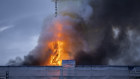 Fire and smoke rise out of the Old Stock Exchange in Copenhagen, Denmark.