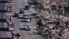 Burnt-out homes along the Pacific Coast in Malibu on Sunday (Monday AEDT).