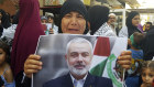 A Palestinian in southern Lebanon holds a poster of Hamas political chief Ismail Haniyeh during a protest to condemn his killing.