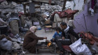 A family breaks fast during Ramadan outside their home destroyed in an Israeli airstrike.