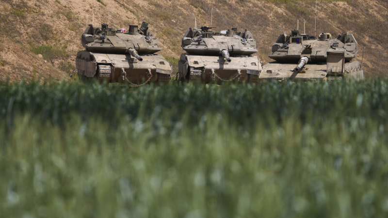 Israeli troops advance in Gaza, retaking part of corridor that splits north from south