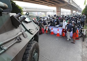 An armoured vehicle parked at a checkpoint in Jakarta on Monday.