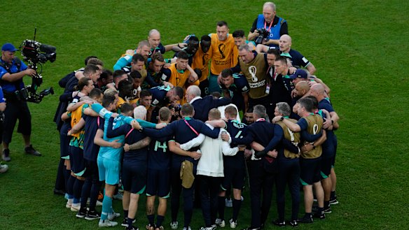 A group hug for the Socceroos after their win against Tunisia. Martin Boyle is among them.