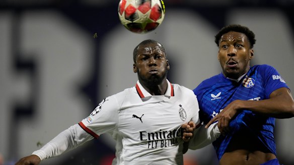 AC Milan’s Yunus Musah, left, and Dinamo’s Ronael Pierre-Gabriel vie for the ball.