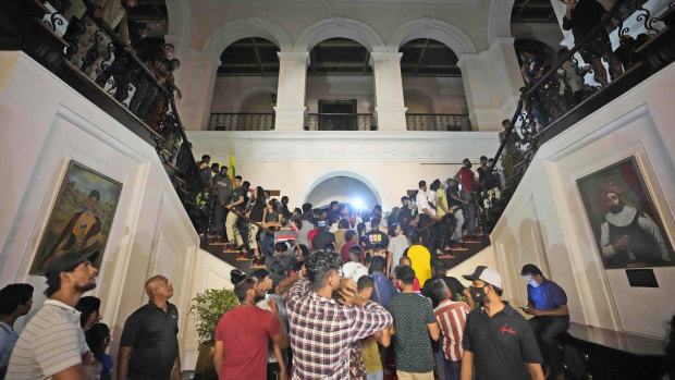 Protesters storm the Sri Lankan president’s official residence in Colombo on Saturday.