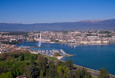 An aerial view of Geneva, with the Jet d'Eau fountain and Lake Geneva.
