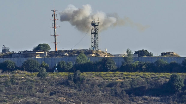 Smoke rises from inside an Israeli army position which was hit by Hezbollah fighters on October 20. 