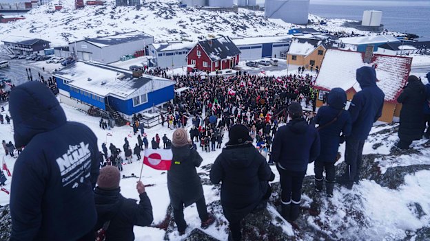 People protest against Trump’s policy towards Greenland in front of US consulate in Nuuk, Greenland, overnight.