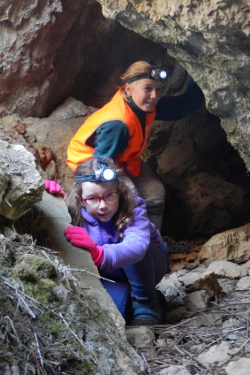 Tim’s two daughters emerge from a cavern on the ‘Little Caves for Little Kids’ tour at Yarrangobilly Caves.