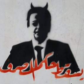 A stencil on the door of Lebanon's central bank in Beirut demands the ousting of Riad Salameh, the bank's governor.