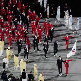 Athletes march under the Russian Olympic Committee flag at Friday’s opening ceremony.