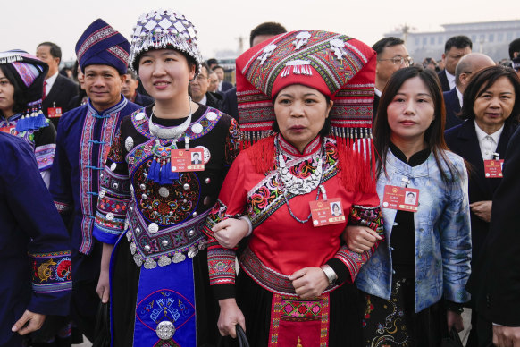 Delegates arrive ahead of the opening session of the National People’s Congress at the Great Hall of the People in Beijing.