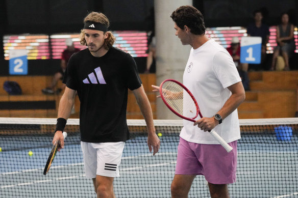 Stefanos Tsitsipas and Mark Philippoussis during practice on Saturday ahead of Sunday’s final.