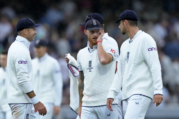 England’s captain Ben Stokes and teammates leave the field as it rains during the third day of the second Ashes Test match.