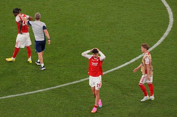 Arsenal players react after losing the Champions League final.