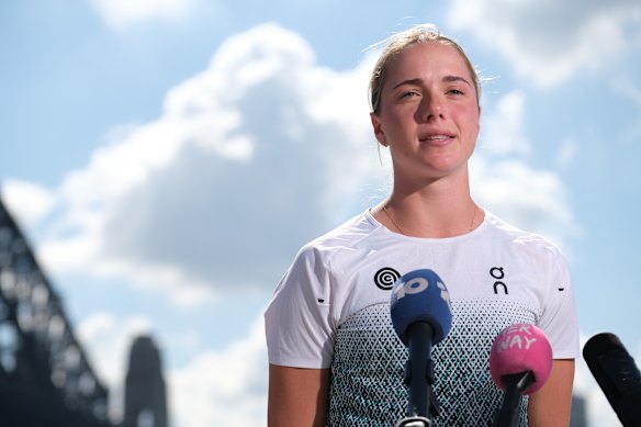 Claudia Hollingsworth talking to media on the edge of Sydney Harbour.