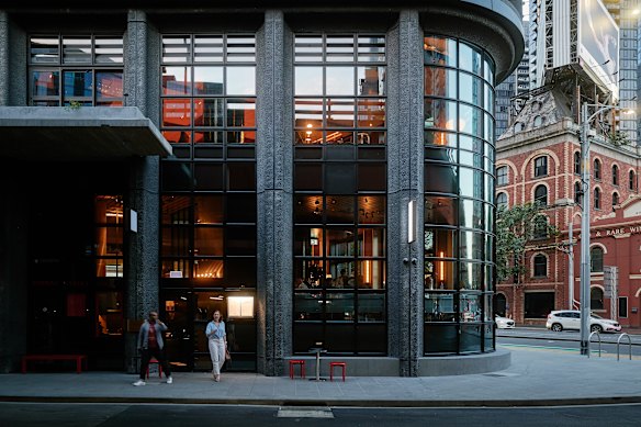 Coupette, nestled within the building’s curved glass corner.