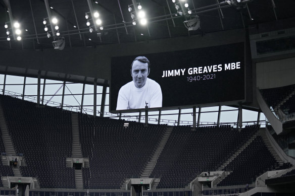 A video screen shows an image of former player Jimmy Greaves before the English Premier League match between Tottenham and Chelsea. 