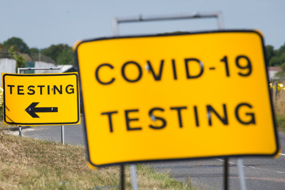 A traffic sign directs people towards the temporary testing centre on the site at Manston Airport in England.