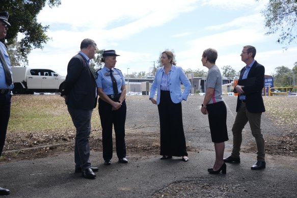 Queensland Premier Annastacia Palaszczuk and key government figures at the site of the new centre on Thursday, with two of the state’s three existing detention facilities in the background. 