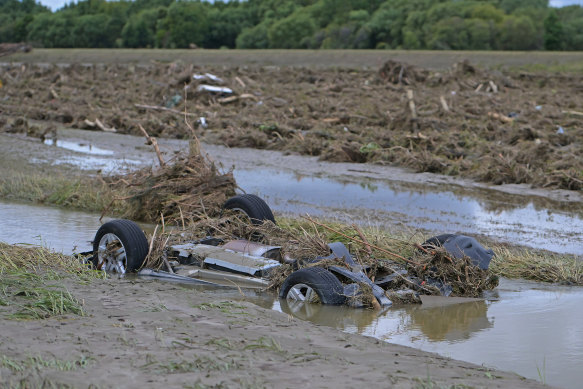 A car is washed into a ditch in Napier, New Zealand.